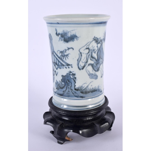 2172 - A CHINESE QING DYNASTY BLUE AND WHITE PORCELAIN BRUSH POT painted with immortals within landscapes. ... 