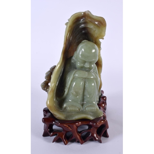 2174 - AN EARLY 20TH CENTURY CHINESE CARVED GREEN JADE FIGURAL GROUP Late Qing/Republic, modelled as a slee... 