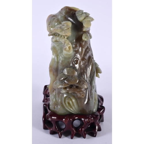 2174 - AN EARLY 20TH CENTURY CHINESE CARVED GREEN JADE FIGURAL GROUP Late Qing/Republic, modelled as a slee... 