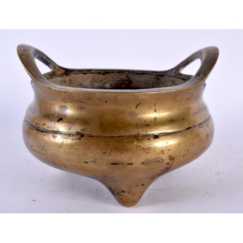 2183 - A 19TH CENTURY CHINESE TWIN HANDLED BRONZE CENSER bearing Xuande marks to base. 1210 grams. 15cm wid... 