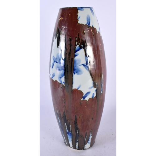 2197 - AN UNUSUAL JAPANESE TAISHO PERIOD STUDIO PORCELAIN VASE overlaid with red lacquer, painted with flow... 