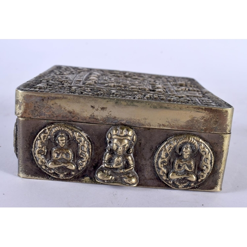 2210 - AN EARLY 20TH CENTURY INDO TIBETAN WHITE METAL SQUARE FORM TRAVELLING BOX overlaid with buddhistic f... 