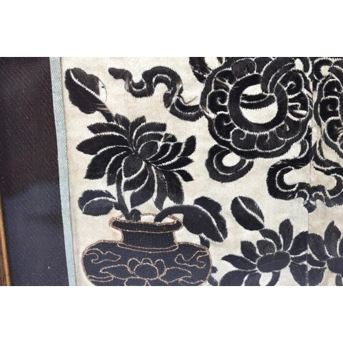 2213 - A 19TH CENTURY CHINESE SILK EMBROIDERED PANEL Qing, depicting urns and flower pots. 48 cm x 22cm.