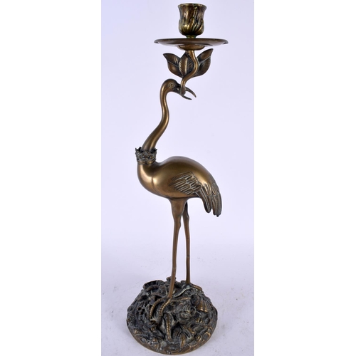 2221 - A LARGE 19TH CENTURY JAPANESE MEIJI PERIOD BRONZE CANDLESTICK formed as a standing bird holding alof... 