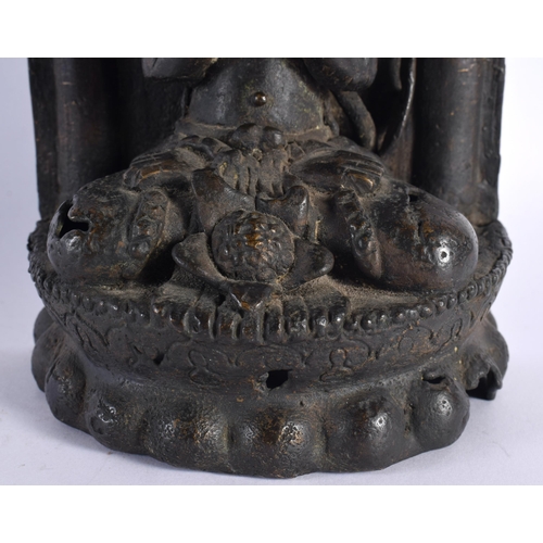 107 - A 17TH/18TH CENTURY INDIAN TIBETAN BRONZE FIGURE OF A BUDDHA modelled with legs crossed, seated in f... 