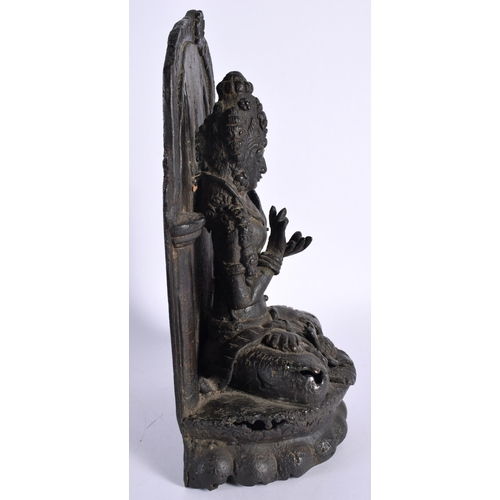 107 - A 17TH/18TH CENTURY INDIAN TIBETAN BRONZE FIGURE OF A BUDDHA modelled with legs crossed, seated in f... 