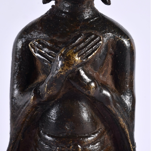 135 - AN 18TH/19TH CENTURY THAI CAMBODIAN SOUTH EAST ASIAN BRONZE BUDDHA modelled wearing a long robe with... 