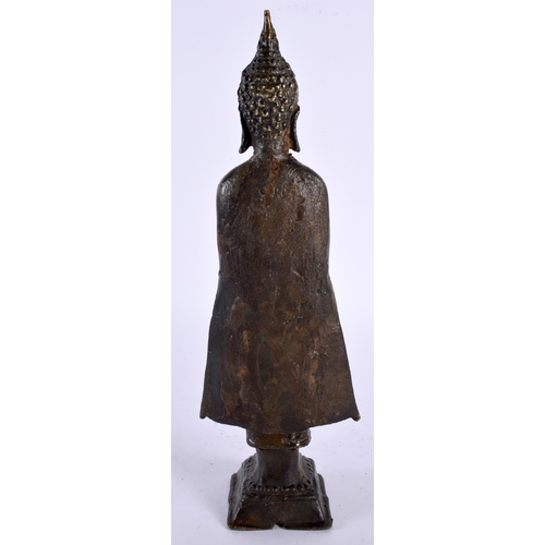 135 - AN 18TH/19TH CENTURY THAI CAMBODIAN SOUTH EAST ASIAN BRONZE BUDDHA modelled wearing a long robe with... 