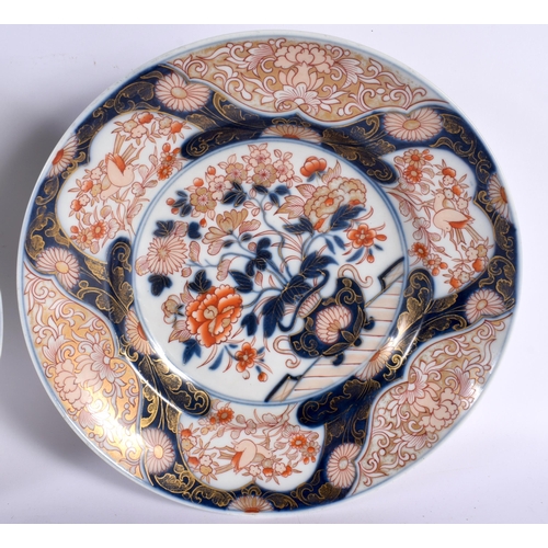 146 - A LARGE PAIR OF 18TH CENTURY JAPANESE EDO PERIOD IMARI PORCELAIN BOWLS painted with urns of flowers,... 