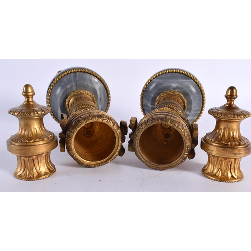 187 - A PAIR OF EARLY 19TH CENTURY FRENCH GILT BRONZE AND MARBLE CASSOLETTES modelled as reversible urns, ... 