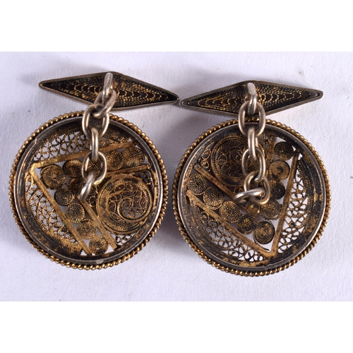 191 - A PAIR OF ANTIQUE YELLOW AND WHITE METAL FILIGREE CUFFLINKS. 10.1 grams. 2.25 cm diameter.