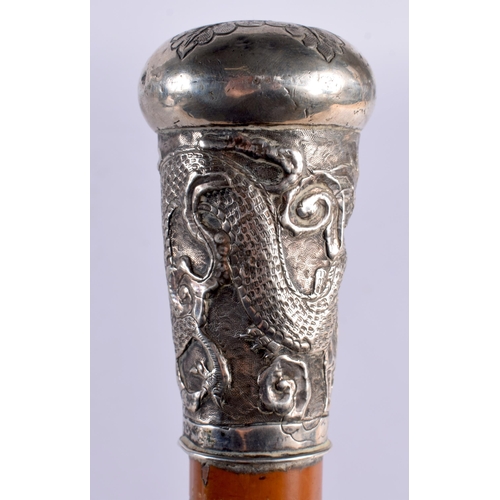 195 - A 19TH CENTURY CHINESE EXPORT SILVER MOUNTED WALKING CANE together with an Indian silver mounted can... 