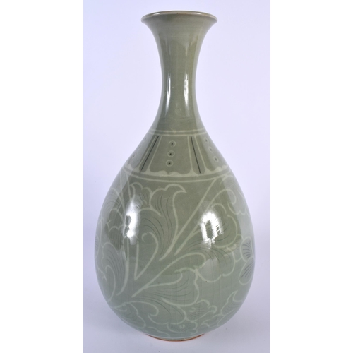 201 - A KOREAN CELADON PORCELAIN VASE painted with flowers and vines. 30 cm high.