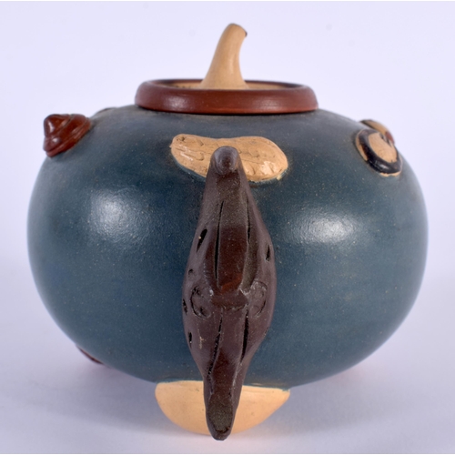 204 - AN EARLY 20TH CENTURY CHINESE YIXING POTTERY TEAPOT AND COVER overlaid with motifs. 13 cm wide.