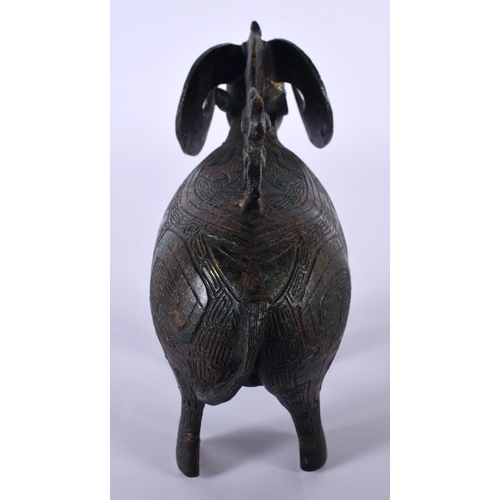 213 - A CHINESE REPUBLICAN PERIOD BRONZE FIGURE OF A STYLISED RAM modelled in the archaic manner. 18 cm x ... 