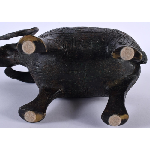 213 - A CHINESE REPUBLICAN PERIOD BRONZE FIGURE OF A STYLISED RAM modelled in the archaic manner. 18 cm x ... 