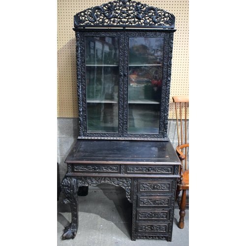 25D - AN UNUSUAL 19TH CENTURY CHINESE CARVED HARDWOOD DISPLAY CASE ON DESK exceptionally carved with drago... 