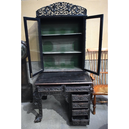 25D - AN UNUSUAL 19TH CENTURY CHINESE CARVED HARDWOOD DISPLAY CASE ON DESK exceptionally carved with drago... 