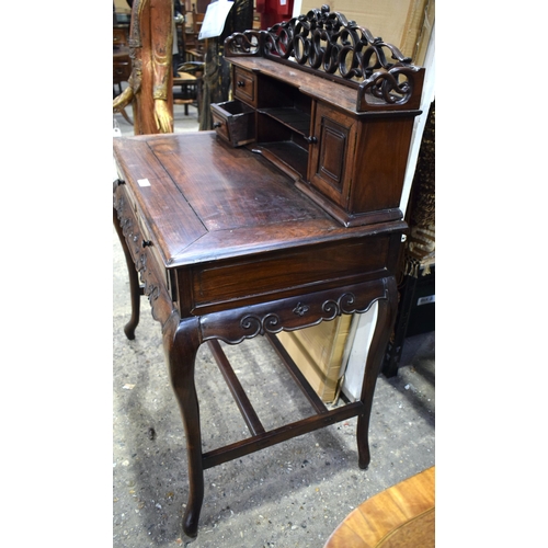 25H - A 19th Century Chinese hardwood two drawer desk with top shelf section and carved frieze gallery 121... 