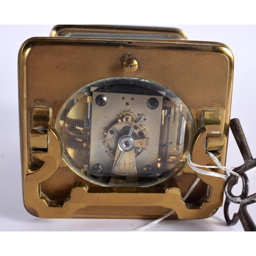 29 - AN ANTIQUE REPEATING CARRIAGE CLOCK. 15.5 cm high inc handle.