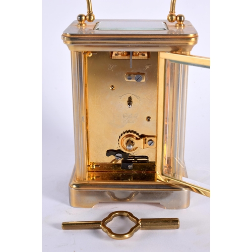 30 - A GARRARD CARRIAGE CLOCK. 15 cm high inc handle.