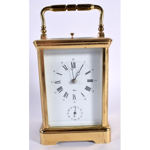 37 - A FRENCH BRASS CARRIAGE CLOCK. 16 cm high inc handle.