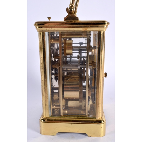 37 - A FRENCH BRASS CARRIAGE CLOCK. 16 cm high inc handle.