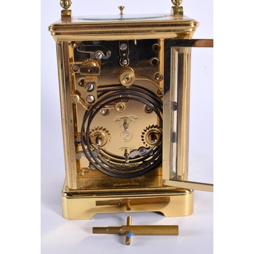 37 - A FRENCH BRASS CARRIAGE CLOCK. 16 cm high inc handle.