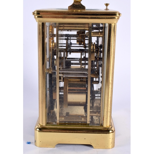 37 - A FRENCH BRASS CARRIAGE CLOCK. 16 cm high inc handle.