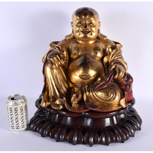 4 - A VERY LARGE EARLY 20TH CENTURY CHINESE CARVED AND LACQUERED GILTWOOD BUDDHA Late Qing/Republic, the... 