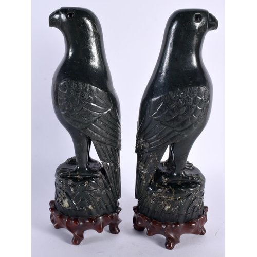 40 - A PAIR OF 19TH CENTURY CHINESE CARVED GREEN JADE FIGURES OF PARROTS Qing, each boldly modelled upon ... 