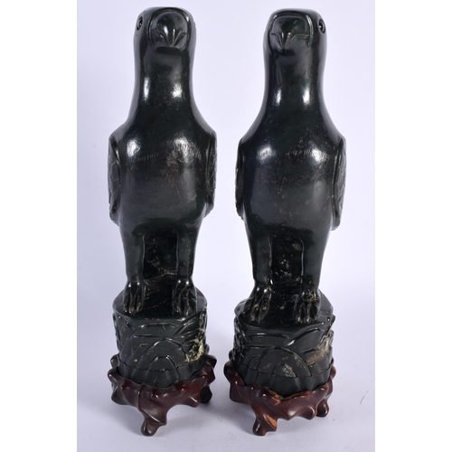 40 - A PAIR OF 19TH CENTURY CHINESE CARVED GREEN JADE FIGURES OF PARROTS Qing, each boldly modelled upon ... 