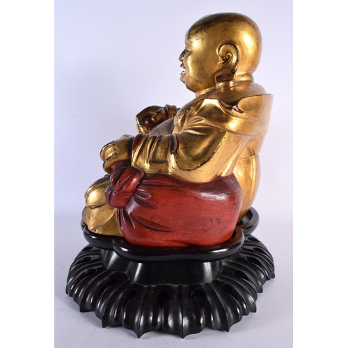 4 - A VERY LARGE EARLY 20TH CENTURY CHINESE CARVED AND LACQUERED GILTWOOD BUDDHA Late Qing/Republic, the... 