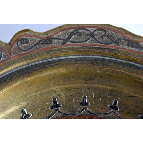 45 - A 19TH CENTURY MIDDLE EASTERN SILVER INLAID MIXED METAL BRONZE KUFIC DISH decorated with foliage and... 