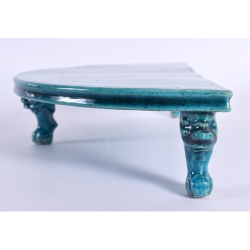 83 - A 17TH CENTURY CHINESE TURQUOISE GLAZED DEMI LUNE PORCELAIN STAND Kangxi, of plain form with Buddhis... 