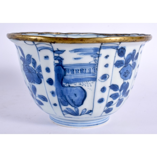 84 - A 17TH CENTURY CHINESE BLUE AND WHITE PORCELAIN RIBBED BOWL Kangxi, with brass rim, painted with spa... 