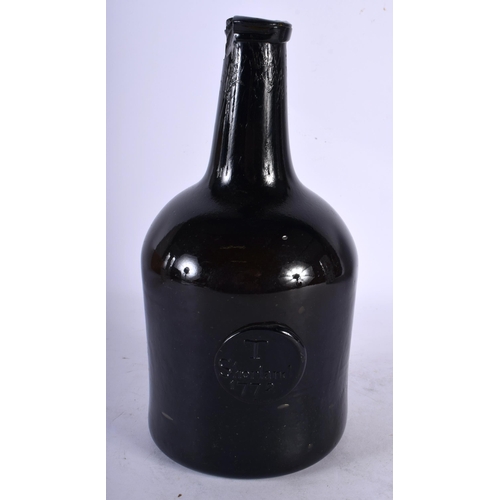 101 - AN 18TH CENTURY ENGLISH WINE BOTTLE bearing seal mark to front T Shortland 1772. 22 cm high.