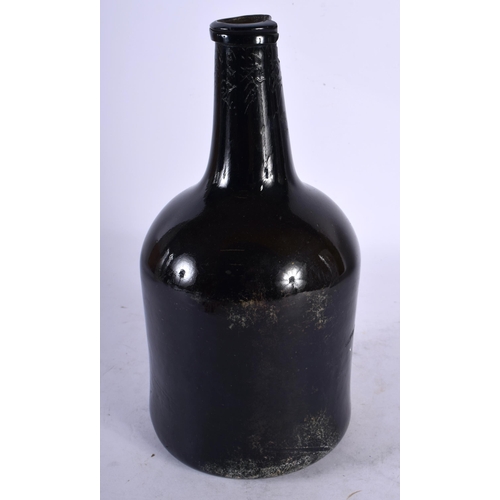 101 - AN 18TH CENTURY ENGLISH WINE BOTTLE bearing seal mark to front T Shortland 1772. 22 cm high.