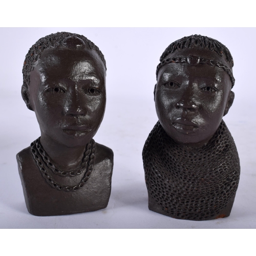 109 - A PAIR OF AFRICAN OJUANG POTTERY BUSTS OF TRIBAL PEOPLE. 10 cm x 4.5 cm.