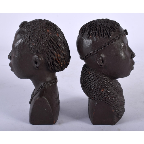 109 - A PAIR OF AFRICAN OJUANG POTTERY BUSTS OF TRIBAL PEOPLE. 10 cm x 4.5 cm.