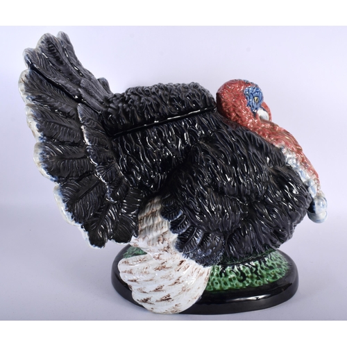 11 - A LARGE AND UNUSUAL ANTIQUE PORTUGUESE MAJOLICA POTTERY TUREEN AND COVER formed as a seated turkey. ... 