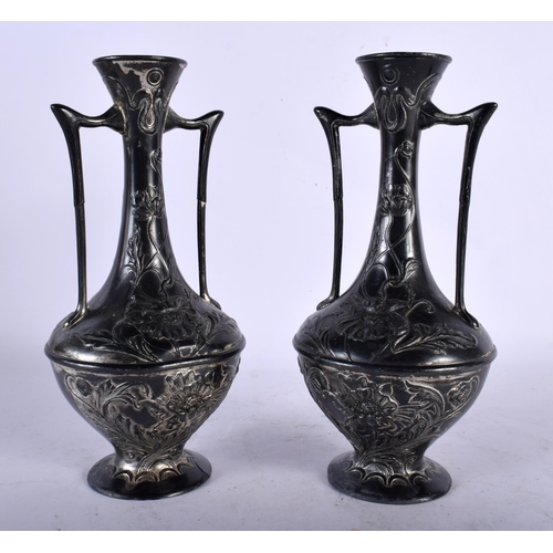 123 - A PAIR OF ART NOUVEAU TWIN HANDLED PEWTER VASES in the Manner of WMF. 21 cm x 8 cm.