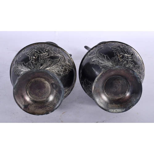 123 - A PAIR OF ART NOUVEAU TWIN HANDLED PEWTER VASES in the Manner of WMF. 21 cm x 8 cm.