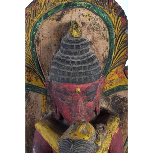 128 - TWO 19TH CENTURY INDIAN PAINTED WOOD BUDDHAS one modelled with hands raised, the other an erotic sta... 