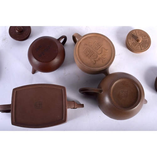 139 - FOUR CHINESE YIXING POTTERY TEAPOTS AND COVERS 20th Century. Largest 15.5 cm wide. (4)