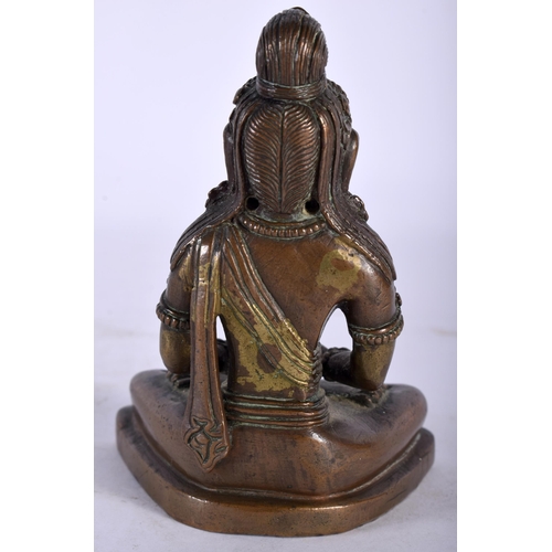 140 - A GOOD 18TH CENTURY TIBETAN NEPALESE BRONZE FIGURE OF A SEATED BUDDHA modelled holding a stupa, upon... 