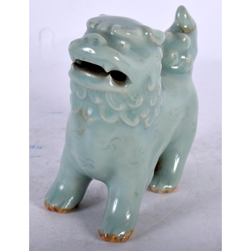 141 - A 19TH CENTURY KOREAN CELADON GLAZED PORCELAIN BEAST modelled scowling. 9 cm x 9 cm.