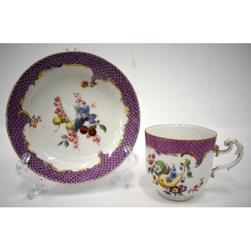 150 - 18th century Meissen coffee cup and saucer painted with fruit under a pink scale border (2) Height 7... 