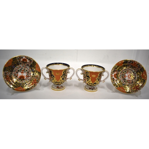 168 - 19th century Derby pair of two handled cups and saucer in an imari pattern, red mark.(4) cup 7.5cm h... 