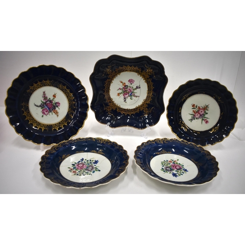 176 - 18th century Worcester wet blue wares: a pair plates painted with Chinese style flowers, Two plates ... 